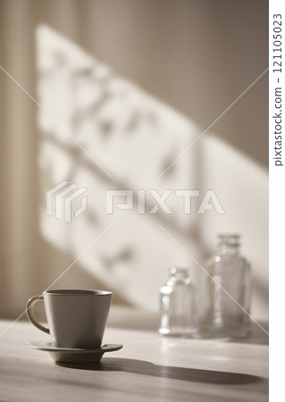 Warm sunlight streaming in through the window, beige background, flowers, vases, and a table with plants. Harmony of light and shadow. 121105023
