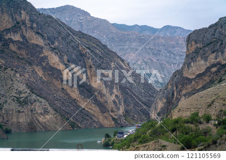 A mountain range with a river running through it 121105569