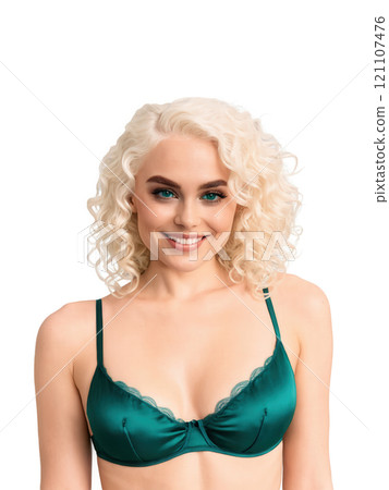 Scandinavian lingerie model with curly platinum blonde hair, blue eyes, slim body type, wearing a satin bralette and thong 121107476