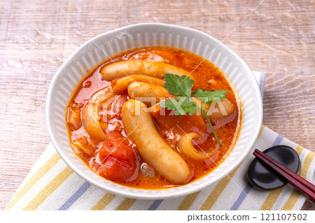 Sausages simmered in tomato sauce Sausages simmered in tomato sauce 121107502