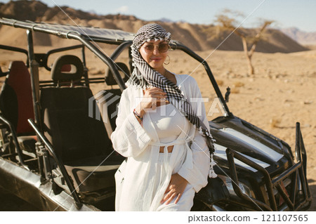 Woman tourist on quad bike ATV safari with desert background of Sharm El Sheikh Egypt 121107565