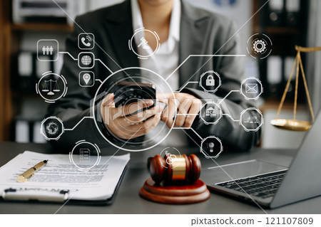 Male judge in a courtroom the gavel, working with smart phone and laptop and digital tablet computer with VR icon. justice and law concept. Male judge in a courtroom the gavel, working with smart phone and laptop and digital tablet computer with VR icon. justice and law concept. 121107809