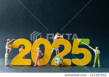 Creative concept of miniature figures painting and constructing the year 2025 Creative concept of miniature figures painting and constructing the year 2025 121107942
