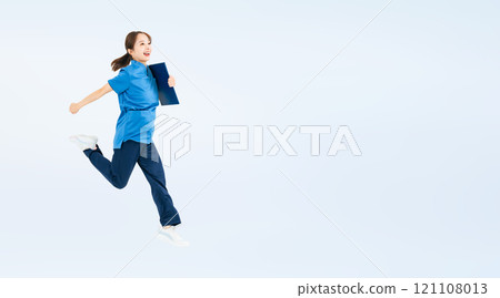 Full body photo of a woman wearing scrubs jumping 121108013
