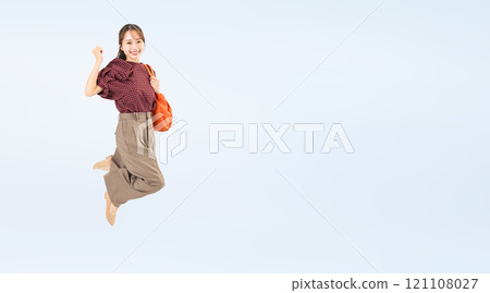 Full body photo of a woman in casual wear jumping 121108027