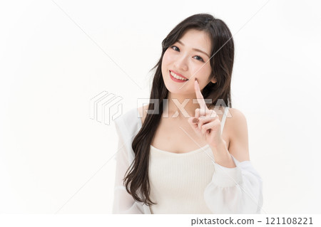 Young woman pointing at her mouth and teeth Dental care 121108221