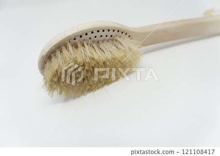 A worn out body brush with shed bristles 121108417