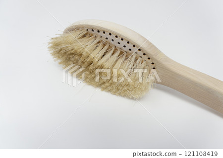 A worn out body brush with shed bristles 121108419