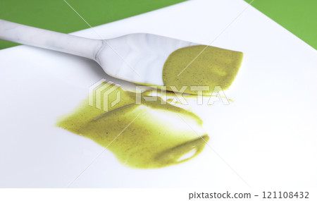 Isolated dab of pistachio cream on white background. Food and creams. Cooking and natural products. Element for design. Isolated dab of pistachio cream on white background. Food and creams. Cooking and natural products. Element for design. 121108432