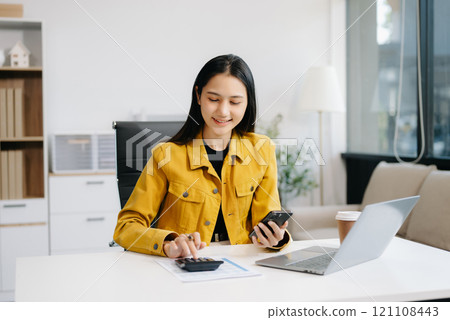 Woman freelancer is working her job on computer tablet and laptop Doing accounting analysis report real estate investment data, Financial 121108443