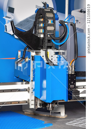 Advanced cutting machine at work in a modern manufacturing facility 121108619