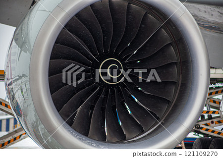 Airplane turbine. Snowing. Engine blades propeller. Aaircraft jet engine. Close up. Aviation Technologies. Aircraft jet black detail during maintenance. Background. Airplane turbine. Snowing. Engine blades propeller. Aaircraft jet engine. Close up. Aviation Technologies. Aircraft jet black detail during maintenance. Background. 121109270