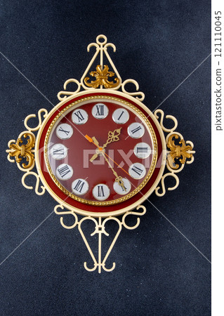 Old wall clock. Roman numerals on the dial 121110045