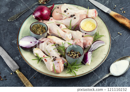 Uncooked raw chicken legs. Uncooked raw chicken legs. 121110232