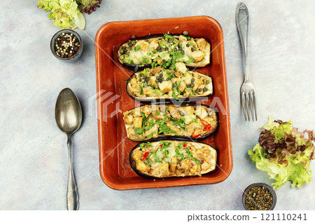 Eggplant baked with meat in baking dish. 121110241