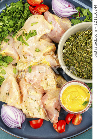 Raw uncooked chicken breast with cooking ingredients. Raw uncooked chicken breast with cooking ingredients. 121110244