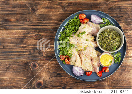 Raw marinated chicken meat cilantro herb. 121110245