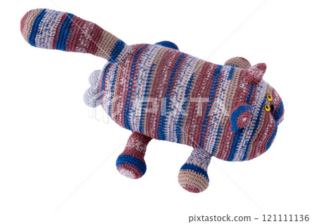 Crocheted toy cat isolated on white background. Knitting doll 121111136