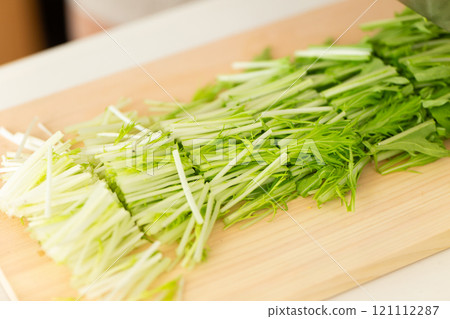 Mizuna on a cutting board Mizuna on a cutting board 121112287