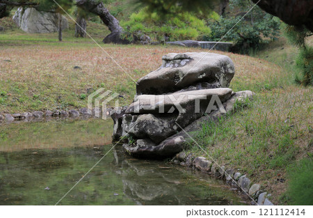 The famous "Mikaeri-jishi" stone near the Ume-rin Bridge in Ritsurin Garden 121112414