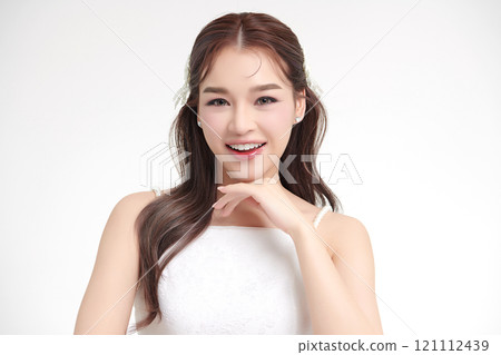 Beautiful young asian woman with clean fresh skin on white background, Face care, Facial treatment, Cosmetology, beauty and spa, Asian women portrait. Beautiful young asian woman with clean fresh skin on white background, Face care, Facial treatment, Cosmetology, beauty and spa, Asian women portrait. 121112439