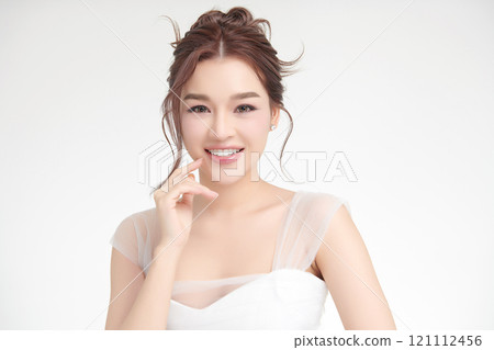 Beautiful young asian woman with clean fresh skin on white background, Face care, Facial treatment, Cosmetology, beauty and spa, Asian women portrait. 121112456