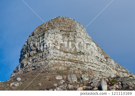 Copy space with scenic view of Lions Head mountain in Cape Town South Africa against a clear blue sky background from below. Beautiful panoramic of an iconic landmark and famous travel destination 121113169