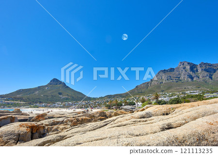 Landscape of mountains and moon on blue sky with copy space. Beautiful rock outcrops of mountaintops near the coastline or bay area. View of Devils Peak and Table Mountain in Cape Town, South Africa Landscape of mountains and moon on blue sky with copy space. Beautiful rock outcrops of mountaintops near the coastline or bay area. View of Devils Peak and Table Mountain in Cape Town, South Africa 121113235