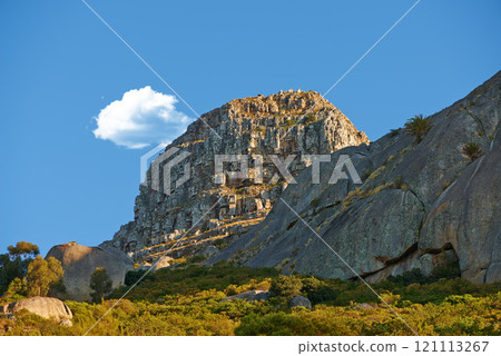 Lions Head. Landscape of Lions Head mountain in Cape Town, South Africa in summer. Rock texture on a hill or mountain peak in a remote hiking area against blue sky. Lions Head. Landscape of Lions Head mountain in Cape Town, South Africa in summer. Rock texture on a hill or mountain peak in a remote hiking area against blue sky. 121113267