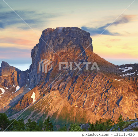 Mountain landscape north of the polar and arctic circle in Norway. Scenic view of snowcapped hills in remote area with clouds in cold winter. Traveling abroad and overseas for holiday and vacation Mountain landscape north of the polar and arctic circle in Norway. Scenic view of snowcapped hills in remote area with clouds in cold winter. Traveling abroad and overseas for holiday and vacation 121113420