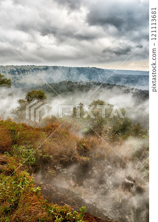 Largest volcano in Mauna Loa. Landscape of smoky mountain on Big Island, Hawaii. Scenic view of Mauna Kea, dormant volcano in open secluded area. A bright cloudy sky near summit of volcanic land 121113681