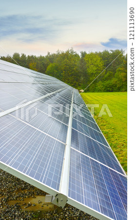 Solar power renewable source in Denmark. Photovoltaic solar cell panels as a natural energy source. Blue solar panels generate electricity in solar power technology, alternative energy from nature 121113690