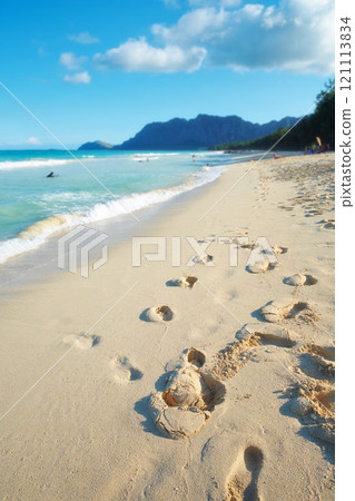 An empty beach, relaxing summer seascape for a peaceful holiday with clear blue sky copy space and footprints in the sand wallpaper. Waves washing onto sandy shore on tropical and exotic resort An empty beach, relaxing summer seascape for a peaceful holiday with clear blue sky copy space and footprints in the sand wallpaper. Waves washing onto sandy shore on tropical and exotic resort 121113834