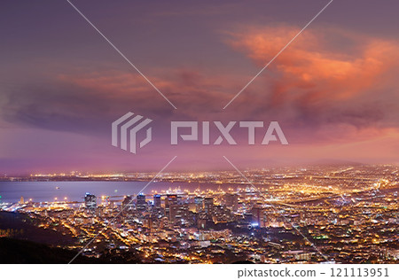 City lights of Cape Town at sunset from above. Dreamy panoramic coastal urban landscape at night. Cityscape near a harbor on purple horizon with clouds. High angle view from Signal Hill, South Africa City lights of Cape Town at sunset from above. Dreamy panoramic coastal urban landscape at night. Cityscape near a harbor on purple horizon with clouds. High angle view from Signal Hill, South Africa 121113951