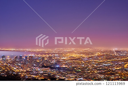 Cape Town after sunset, a cityscape view from Signal Hill, South Africa. Bright lights over a city landscape on a beautiful summer evening. panoramic of the city. Illuminated buildings and streets Cape Town after sunset, a cityscape view from Signal Hill, South Africa. Bright lights over a city landscape on a beautiful summer evening. panoramic of the city. Illuminated buildings and streets 121113969
