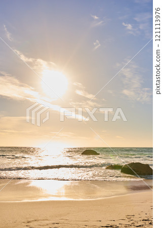 Copy space landscape and seascape view of a sunset at tropical beach in summer. Idyllic seaside tourist attraction in Camps Bay, Cape Town in South Africa. Holiday resort at seashore on vacation Copy space landscape and seascape view of a sunset at tropical beach in summer. Idyllic seaside tourist attraction in Camps Bay, Cape Town in South Africa. Holiday resort at seashore on vacation 121113976
