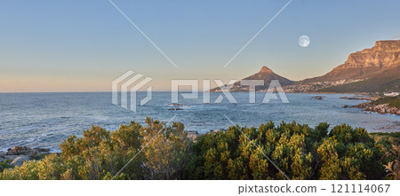 Landscape view of sea water, mountains and a blue sky with copy space of Lions Head and Table Mountain in Cape Town, South Africa. Calm, serene, tranquil, ocean and relaxing nature scenery at sunrise Landscape view of sea water, mountains and a blue sky with copy space of Lions Head and Table Mountain in Cape Town, South Africa. Calm, serene, tranquil, ocean and relaxing nature scenery at sunrise 121114067