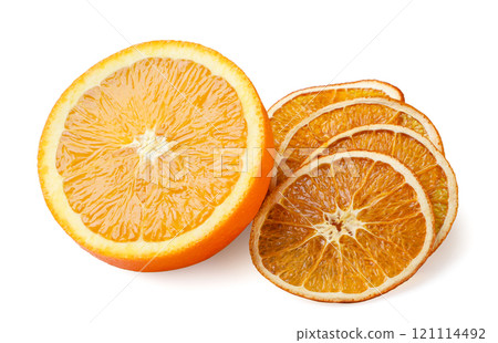 Dried orange fruit slices and half close up on white. Isolated Dried orange fruit slices and half close up on white. Isolated 121114492