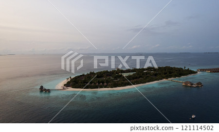 Top view of the sunset over an island in the ocean Top view of the sunset over an island in the ocean 121114502