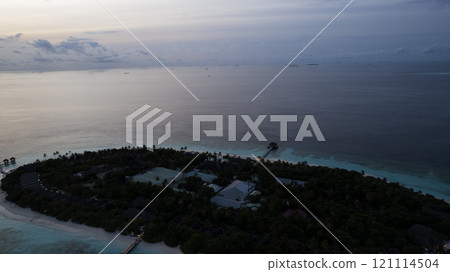 Top view of the sunset over an island in the ocean Top view of the sunset over an island in the ocean 121114504