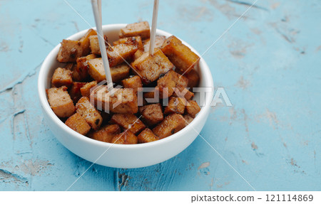 marinated tofu cubes with wooden skewers 121114869