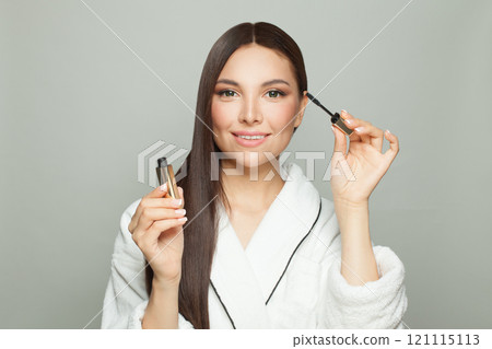 Close up photo of charming attractive lady holding black mascara 121115113