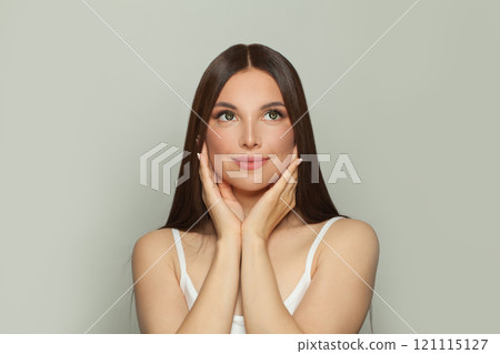 Healthy young woman model with natural make-up and long straight brown hair portrait 121115127