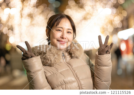 A woman smiling at the illuminations 121115526