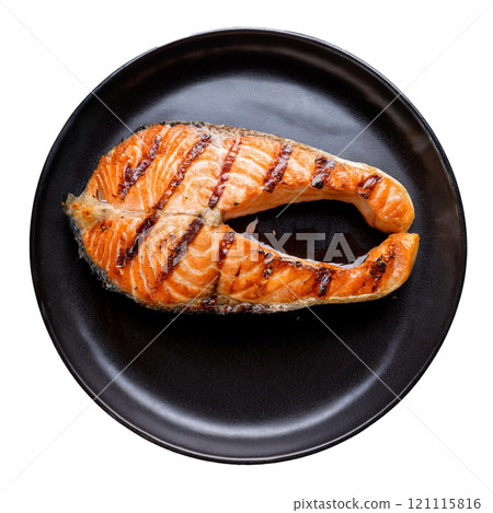 Grilled salmon steak with crispy skin and tender flesh, isolated on transparent background, perfect for food photography, seafood dishes, and healthy meal styling 121115816