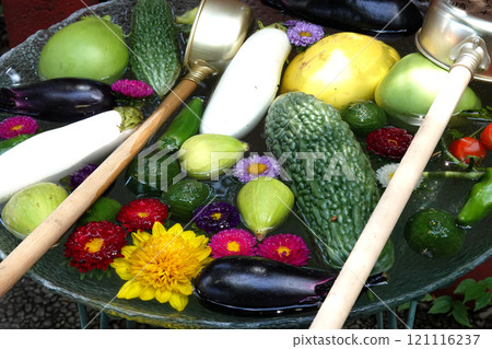 Colorful vegetables floating in a water basin Colorful vegetables floating in a water basin 121116237