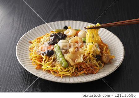 Fried noodles with thickened sauce, noodles picked up with chopsticks Fried noodles with thickened sauce, noodles picked up with chopsticks 121116596