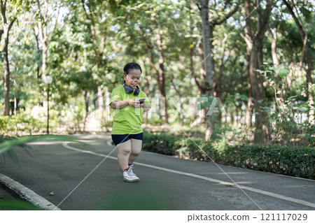 Energetic Petite Woman Jogging in a Lush Green Park on a Sunny Day, Embracing a Healthy Lifestyle and Fitness Routine in Nature Energetic Petite Woman Jogging in a Lush Green Park on a Sunny Day, Embracing a Healthy Lifestyle and Fitness Routine in Nature 121117029