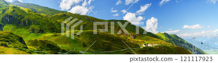 Picturesque Mountain Landscape with Lush Green Hills and a Clear 121117923