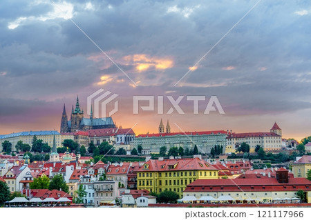 Picturesque Prague cityscape with historic buildings and cloudy sky at sunset Picturesque Prague cityscape with historic buildings and cloudy sky at sunset 121117966